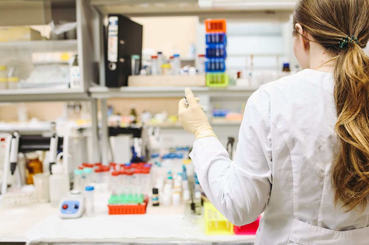 A person working in a lab, showing the impact of shift work on pharmacists