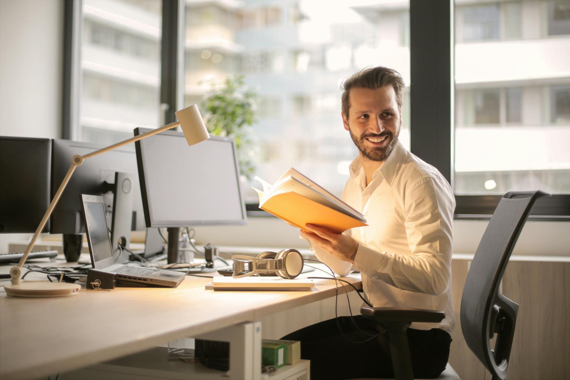 a man in the office thinking about how relocation impacts workplace productivity.